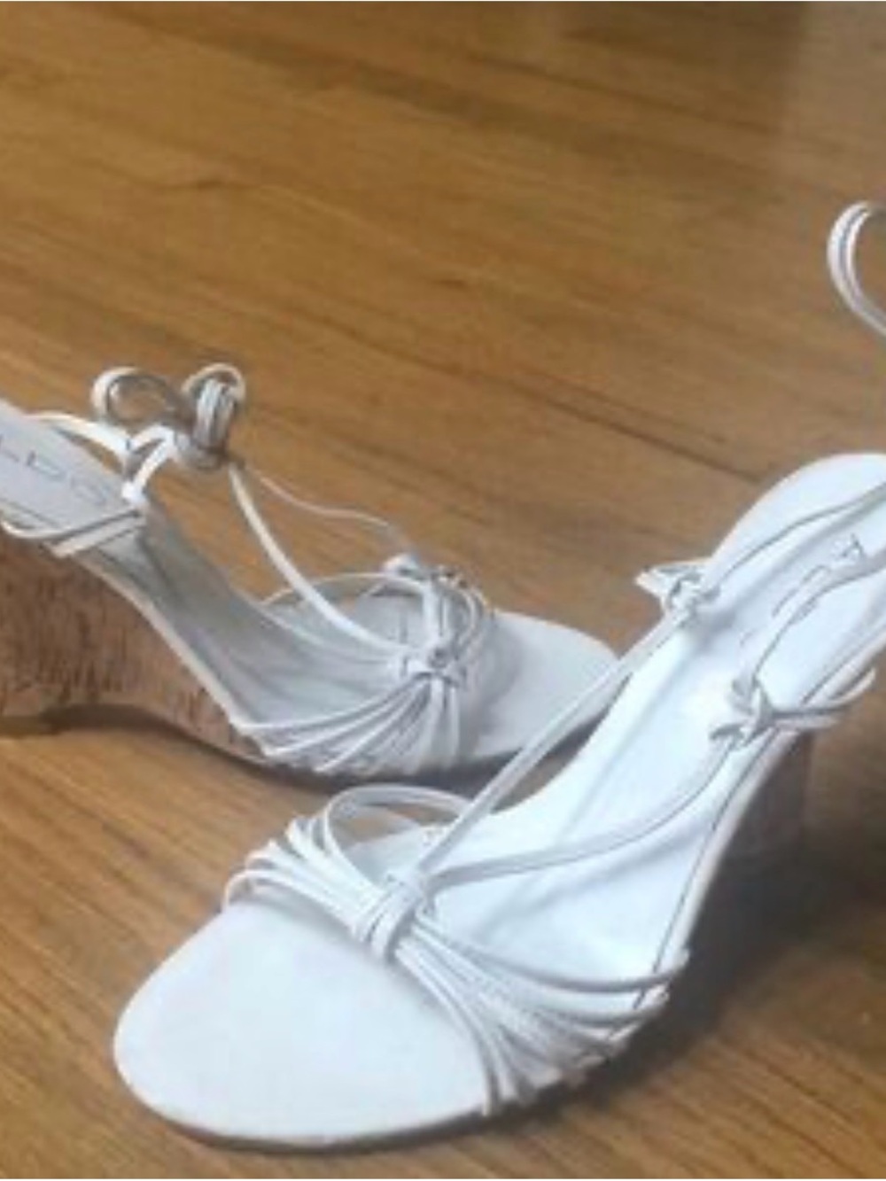 Aldo white strappy sandal with distinctive cork wedge heel